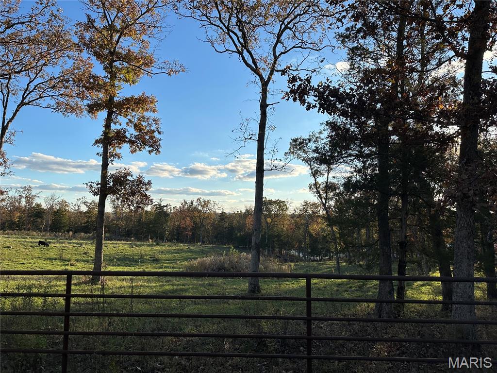Charming Country Home on 10.5 Acres – Perfect for a Mini Farm!
10.50-acre property offers everything you need for a mini farm or country lifestyle. The land is fully fenced with pipe and barbed wire fencing, featuring a pond, workshop, barn, and a chicken house – ideal for livestock, horses, or hobby farming.
The inviting 3-bedroom, 2.5-bath home features an open floor plan with plenty of natural light, creating a warm and welcoming atmosphere. There is also a second kitchen and family room on the lower level. Enjoy the tranquility of rural living while still having all the modern comforts of home. Whether you’re looking to raise animals, garden, or simply enjoy the peace and space of the countryside, this property has it all!