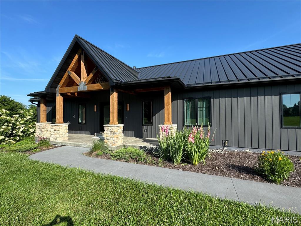 "Wow" is all I can say about one of the nicest listings I have had the honor of working on in years! This magnificent home sits on 38+ park-like acres! It has an extremely low maintenance exterior so you can focus on life instead of upkeep! Home has almost 4,000 sq. ft of living space... combine that w/ quality of construction, the elegance of design, & high-end finishes, & this home is sure to impress! From the covered timber-frame front porch to roomy entry foyer, this home invites you in & you just don't want to leave! Big picture windows grace the back of the house, along with a beautiful screened-in porch that leads to a huge deck overlooking your own "State Park!" The rock outcroppings & waterfalls that run when it rains are simply breathtaking! A great trail system takes you to bottom fields that are perfect for food plots! Deer, Turkey, & other wildlife call this 38+ ac's home! Back at the "Lodge," you have Geothermal heating & cooling!  Additional Rooms: Sun Room Duplicate Listing to MLS#26009104.