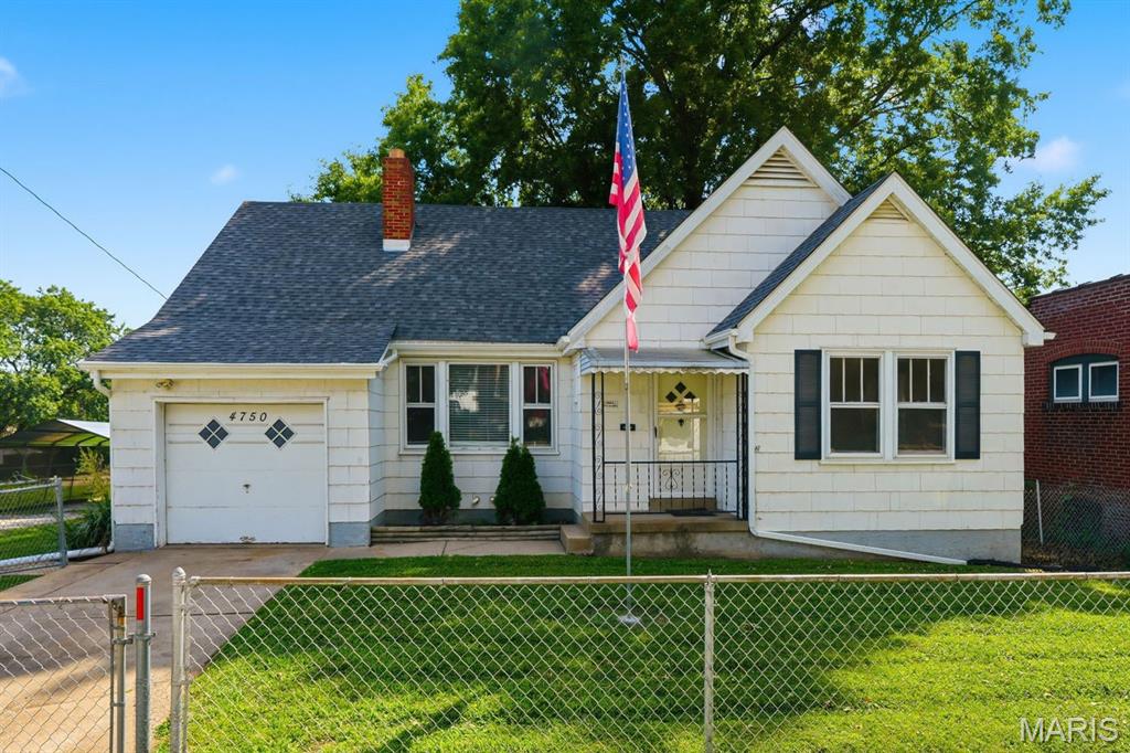 Opportunity awaits in this charming 1.5-story home situated on three level lots totaling approximately 0.39 acres in desirable 63123!  Offering approximately 1,599 square feet, 3 bedrooms, and 2 full bathrooms, this property is ideal for investors, owner-occupants looking to build equity, or buyers seeking flexible living arrangements.  The main level features original character throughout including arched walkways, wood flooring, a woodburning fireplace, spacious living room, sunroom overlooking the fenced backyard, and a functional kitchen with original cabinetry, farm sink, tile flooring, and a gas range.  Two bedrooms and a full bathroom complete the main floor.  The upper level presents unique investment potential with its own kitchenette, living area, bedroom, and full bathroom — ideal for a roommate setup, extended family living, guest quarters, or possible rental opportunity.   The walk-up lower level offers plenty of storage space and washer/dryer hookups.  Exterior features include an attached single-car garage, a detached carport, additional gravel driveway, and abundant off-street parking.  The large fenced yard provides plenty of outdoor space and flexibility.  Major mechanical updates include a new roof (2025) and new water heater (2026), while the heating and cooling systems were replaced in 2012.  Property is being sold AS-IS.  Home will require repairs and updates, but offers strong potential for the right buyer looking for space, character, and opportunity.