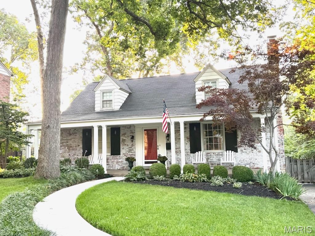 The curb appeal sets the tone for this timeless, charming and updated home! The sun filled living room features a pretty fireplace flanked by windows and bookshelves. The spacious eat-in kitchen opens to a delightful sunroom which provides easy access to a backyard oasis with a patio, gorgeous landscaping and plenty of green space for relaxing or entertaining. Two bedrooms and a full bathroom complete the main level. Upstairs, you will find two generously sized bedrooms and a second full bathroom, offering space for family, guests or a home office. The lower level offers flexible recreation space and abundant storage. A one car garage adds everyday convenience. Located in highly sought-after Warson Woods!