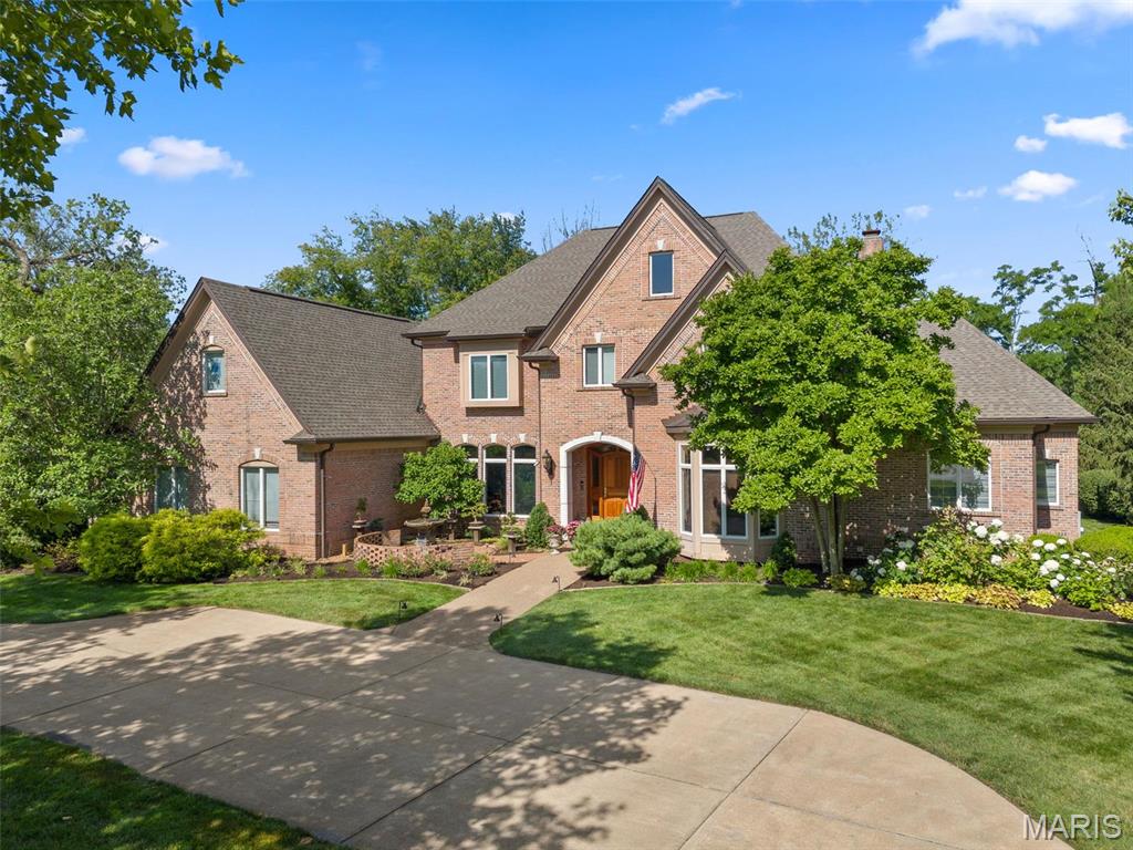 Located on coveted Bridle Lane in the heart of Frontenac, this nearly 8,500 sq ft estate blends luxury, comfort & timeless elegance on a beautifully landscaped 1-acre lot. With 5 bedrooms, 5 full & 3 half baths, this gorgeous home features primary suites on both the 1st & 2nd floors. A chef’s kitchen w/ quartzite surfaces, high-end appliances & a butler’s pantry anchors the main level w/ its 10' ceilings & also includes a cozy hearth rm, elegant dining rm & living rm, an amazing office w/ box beam ceiling, built-ins & a gas FP, 2 powder rms & a utility rm w/ laundry option. Upstairs you'll find the 2nd primary suite w/ a steam shower connecting dual bathrooms, 2 more ensuite bedrooms, a bonus rm & a laundry rm. The 10' pour lower level includes a family rm & rec rm separated by a see-through fireplace, theater rm, ensuite guest bedroom, 1/2 bath & kitchenette. 4 fireplaces, 4 HVACs (’24), gorgeous millwork thru-out, an oversized 3-car garage, Ladue Schools & a perfect yard for a pool!