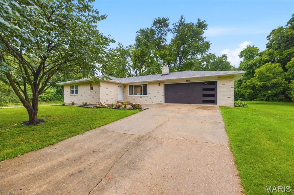 Dont wait... Located close to downtown but with an out of town feel- this 3 bedroom, 2 full bath, full brick ranch at 781 Wilder St offers approximately 1400 square feet of finished living space on a large shady lot. This well maintained and fully remodeled home combines classic construction with all new modern updates. The house has been completely redone. The main level features an open floor plan with new flooring, completely remodeled bathrooms, bedrooms, and kitchen with stainless appliances, fixtures throughout etc. Outside brand new roof, gutters, windows, doors, deck makes this home virtually maintenance free for years to come. The new deck extends the living space outdoors and overlooks the landscaped backyard creating a private, park like setting ideal for relaxing and entertaining. The unfinished basement includes a fireplace and unlimited options for layout and finish.   Additional features include an expansive driveway and attached two car garage finished in new metal and providing ample parking and storage. Located within the Ste Genevieve School District and just minutes from downtown, schools, and the shopping district- this property offers both convenience and a quiet residential setting in the heart of it all!