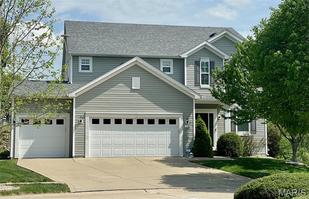 This beautiful two-story home offers over 3,000 sq. ft. of living space & is situated on a quiet cul-de-sac backing to common ground & located in Francis Howell school district. The property features a desirable 3-car garage, 9’ ceilings on the main level, & hardwood flooring throughout most of the first floor.
The spacious luxury kitchen is a standout with granite countertops, stainless steel appliances, & a convenient corner pantry. Step out from the kitchen onto the large private deck—perfect for morning coffee or outdoor dining with family and friends.The main level also includes a formal dining room, living room, private office, & a welcoming great room with a cozy gas fireplace—ideal for both everyday living & entertaining.Upstairs, you’ll find four generously sized bedrooms & three full baths. The luxurious primary suite features a massive walk-in closet & a spa-like ensuite with double vanity, soaking tub, & separate shower. One of the secondary bedrooms includes its own en suite bath, & a versatile loft offers additional living or workspace. The upstairs laundry room adds everyday convenience—no more hauling laundry up & down stairs.The finished walkout basement expands your living space with a large rec room & dedicated media room, complete with projector & screen—perfect for movie nights or game days.Additional bonuses: the home comes equipped with custom-fit, pre-cut Christmas lights designed specifically for the property. Newer roof (2025), some new windows (2025), Newer Hot Water Heater and Irrigation system. Home is just minutes from John Weldon Elem!