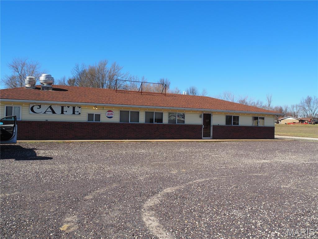 Awesome Potential, 2 great properties, highway frontage, visibility and all sitting on 1.05 acres just bring your imagination. The large building is 2600 sq ft and can be made into about anything. It would make a great Montessori School, daycare, retail, apartments or simply add the finishing touches for a nice sized residential property, with an additional 1200 sq ft rental or in-law quarters with a 20' x 20' garage. This is a rare chance to get so much at such a great price.  Parking lot is gravel but has about 280' of Hwy 28 frontage. The possibilities are endless, don't miss this opportunity!