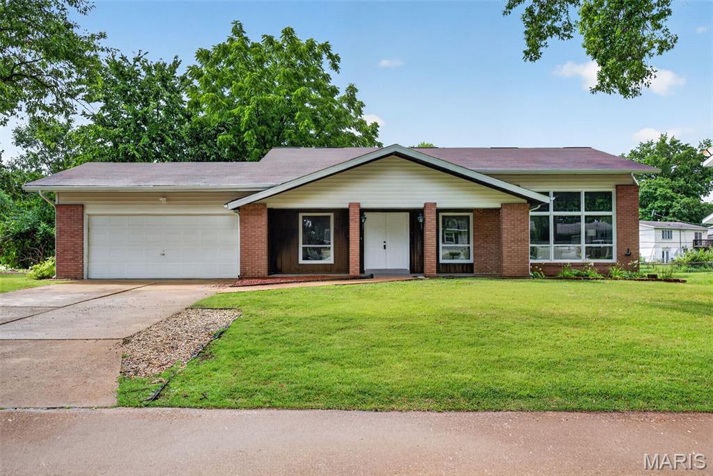 One-of-a-Kind Split-Level on a Large Corner Lot in Hazelwood! Welcome home to this one-of-a-kind split-level situated on a large corner lot, offering outstanding curb appeal and plenty of outdoor space. Featuring 3 bedrooms, 2.5 bathrooms, a 2-car attached garage, and a walkout basement, this home combines comfort, functionality, and room to grow. The upper level features all three bedrooms and two full bathrooms, including a spacious primary suite complete with a private en suite bathroom. This thoughtfully designed layout keeps the bedrooms together while providing a private retreat for the homeowners. The split-level floor plan offers multiple living spaces, perfect for entertaining or everyday living. The walkout basement adds even more flexibility, making it ideal for a family room, recreation area, home office, workout space, or playroom, with direct access to the backyard. Just when you think there you have seen all the living spaces, there is another bonus level with a room full of built-ins. Outside, the expansive corner lot provides plenty of space for outdoor gatherings, gardening, or simply relaxing. Conveniently located near shopping, dining, parks, schools, and major highways, this unique Hazelwood home is one you won't want to miss. Schedule your private showing today!