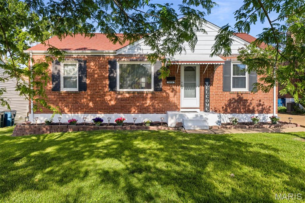 Look no further than this updated brick ranch in Affton Schools! Great curb appeal with lovely landscaping welcomes you inside to the bright living room with a charming archway and luxury vinyl plank flooring that continues throughout the home. The eat-in kitchen features white cabinets and a tile backsplash. The kitchen looks out into the bright sun room addition, with skylights and exposed brick wall. Off the kitchen is a storage room with shelving, plus a hook-up for a washer and dryer. It can be converted into a 3rd bedroom. Two bedrooms and an updated bathroom w/step-in shower complete the main level. The finished basement adds a large rec room with plenty of space for a family room, home office, and game area. You'll have room for storage as well. The backyard is a plant-lover's dream! You'll have a spacious greenhouse, raised garden bed, and detached garage for extra storage. Enjoy the summer in the large fenced yard! Just steps from St. George Park, with quick access to I-55 and all of the shopping and restaurants along Gravois, this charming home is in a great location. Don't miss out!