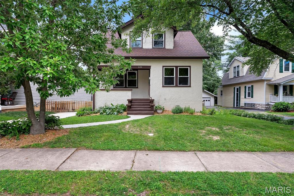 Welcome home to 634 Yeddo Avenue... nestled on a quiet, not-thru street, this 3 bed, 2 bath bungalow oozes charm and function. From the covered porch, step inside to the living room with low-profile coffered ceiling that flows to the dining room and into the chef's kitchen with gorgeous garden sage cabinets, butcher block counter tops, and Samsung Bespoke appliances. The family room with custom built-ins, a bedroom, and full bath complete the main level. Up the turned staircase from the living room are the other 2 bedrooms and bathroom. The walk-out lower level boasts lots of storage space, houses the laundry, and has a rec room that looks out over the level, fenced yard. The real magic is the garage that has been turned into screened outdoor living space that is set at the end of a stepping stone path. It's the ultimate entertaining spot with a vaulted, beamed ceiling that's been specially curated for conversation and comfort. You will not want to miss this opportunity!