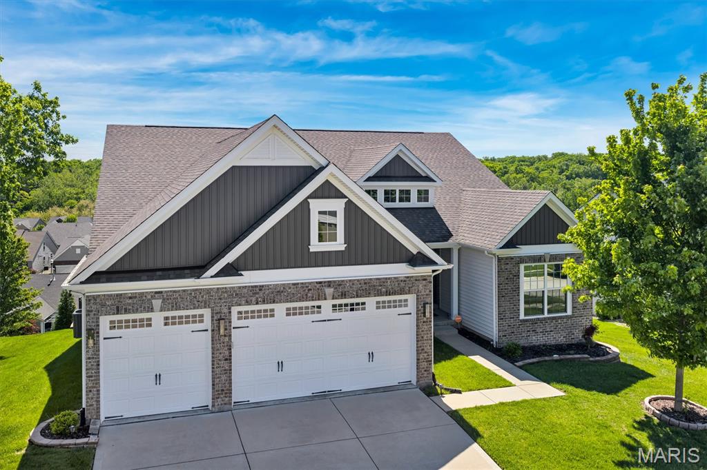 Stunning ranch home in the highly sought after Wilmer Valley community offering over 4,100 sqft of finished living space! This 5 bed, 4 bath home features an open floorplan with vaulted ceilings, hardwood floors, and an abundance of natural light throughout. The spacious great room centers around a floor to ceiling stone fireplace and flows seamlessly into the beautifully updated kitchen with oversized center island, quartz countertops, walk in pantry, tile backsplash, and stainless appliances. The main level includes a luxurious primary suite with spa like bath and walk in closet, plus 3 additional bedrooms and 2 full baths. The finished walk out lower level adds incredible extra living space with a massive rec room, additional bedroom, full bath, and plenty of storage. Situated on a premium fenced lot backing to scenic views, the backyard offers endless potential for entertaining, relaxing, or adding your dream outdoor oasis. Oversized 3 car garage, sprinkler system, and prime Wentzville location near schools, shopping, restaurants, and highways complete the package. This one truly checks all the boxes!