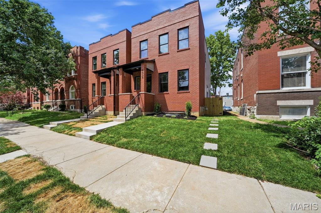 LAST HOME REMAINING! Who doesn't love that NEW HOUSE SMELL!? Two side-by-side brand new homes to choose from! Freshly completed NEW CONSTRUCTION in The Grove with over 2,600 sq ft of total finished space with 4 bedrooms, 3.5 baths & designer finishes throughout! A gorgeous brick facade and covered front porch invites you into an OPEN CONCEPT main floor with formal living room, an open dining area to a great kitchen w/center island, custom cabinets, pantry, SS appliances & granite counters, plus a great family room & half bath. Upstairs offers 3 nicely sized bedrooms, including a fantastic primary suite w/gorgeous bathroom, full hall bath & 2nd floor laundry room! PLUS, an approx 900 sq/ft finished lower level that can be used as great extra living space -OR- consider a house-hacking/travel nurse apartment, in-law suite or live/work space if you wish! It features its own spacious living & dining room, full kitchen, bedroom with legal egress, full bathroom & laundry room. Out back find a level privacy-fenced yard, concrete patio & new 2-car garage w/opener & EV car charger ready. This one is a MUST SEE!