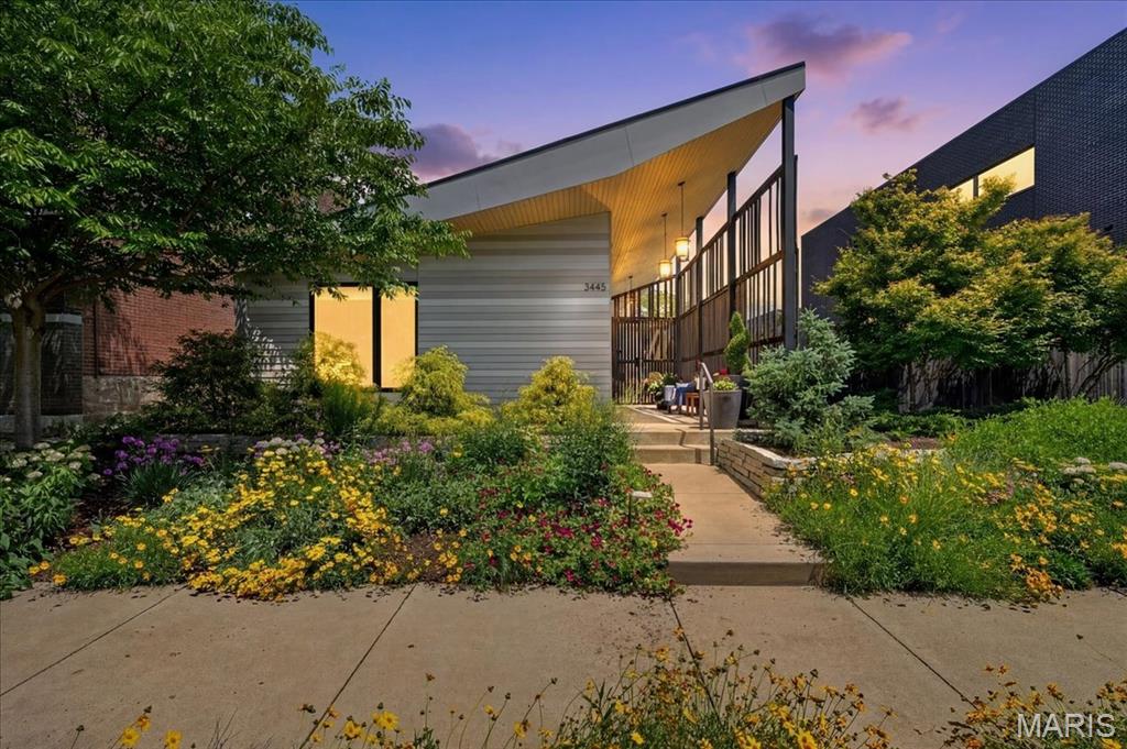 Rarely does a residence of this architectural caliber become available in the city of St. Louis. Published in local home and design magazines for its distinctive architecture and striking indoor outdoor living, this custom built contemporary retreat captures the spirit of Palm Springs modernism while offering a lifestyle rarely found in the local market.
Designed for both everyday living and unforgettable entertaining, the dramatic open concept floor plan is anchored by a stunning movable glass wall system that completely opens the living space to the resort style pool and hot tub beyond, creating a seamless connection between indoors and out. A suspended rotating fireplace serves as a sculptural focal point within the main living area, while warm modern finishes and curated materials create an atmosphere that is both refined and inviting.
The sleek kitchen flows effortlessly into expansive living and dining spaces designed to maximize light, openness, and connection. The primary suite offers a private retreat with spa inspired bath and direct access to outdoor living spaces, while the second bedroom and bath provide flexibility for guests, office, or studio use.
Beyond the pool area, a separate garden space offers endless potential for additional outdoor living, entertaining, landscaping, or personal retreat. Additional features include a two car garage port and a partial deep pour basement offering exceptional storage and potential for additional living space.
Located in the heart of the vibrant Tower Grove area, surrounded by one of the city’s most rich and diverse neighborhoods, residents enjoy easy access to celebrated restaurants, neighborhood cafes, shopping, nightlife, bars, and the energy that has made this one of St. Louis’ most sought after urban communities, all just a short stroll away.
A truly one of a kind offering for the buyer who values exceptional design, modern living, and homes that leave a lasting impression.