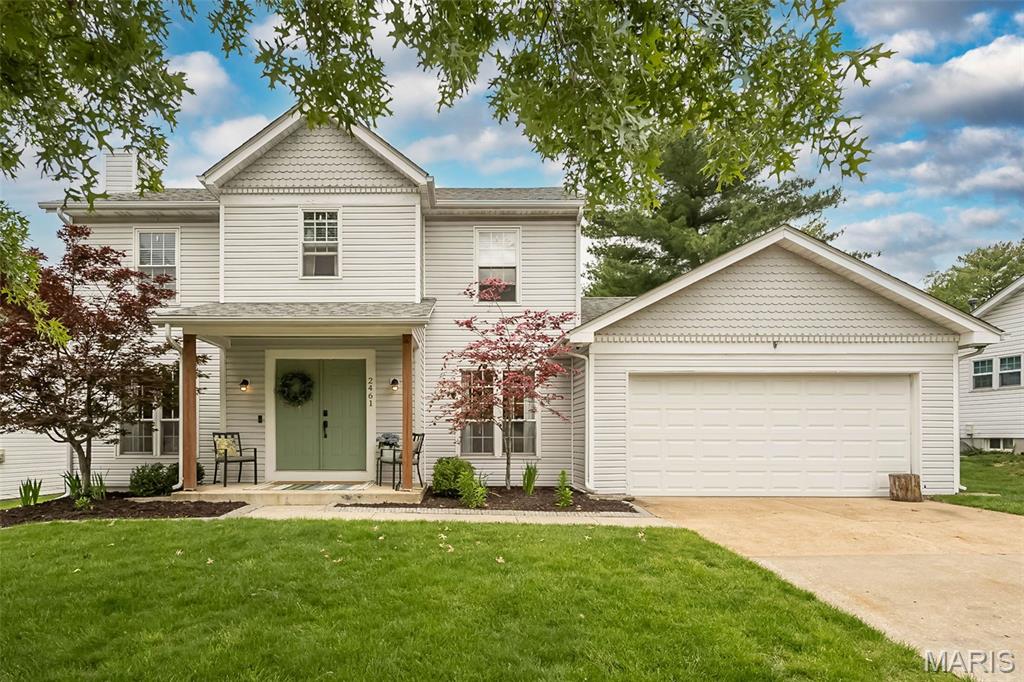Welcome to this charming 2-story home offering 4 bedrooms, 3.5 baths, and a functional, well-designed open layout. 
Step inside to find warm wood flooring flowing through the main level, a welcoming entry with an open staircase, and a dedicated dining space perfect for gatherings. The spacious living room features a cozy fireplace and a wall of windows that fill the space with natural light while offering relaxing views of the backyard. Solid surface counters, upgraded fixtures, stainless appliances, 42" cabinets all combine to make the kitchen the heart of this home.
Enjoy the convenience of main floor laundry and a practical floor plan designed for modern living. Upstairs, four generously sized bedrooms provide plenty of space for family, guests, or a home office.  All the baths have been updated!
The lower level offers additional finished space, ideal for a rec room, play area, or workout zone, with room to expand as needed.
Step outside to a level, fenced backyard—perfect for pets, play, and entertaining—complete with a covered patio that provides a great spot to unwind or host gatherings rain or shine.
An inviting front porch, mature landscaping, and attached garage complete the package. Located in the highly sought-after Rockwood School District, walking distance to Green Pines Elementary!! This home combines curb appeal with everyday comfort, easy access to the Wildwood Town Square, hiking and biking trails, wonderful parks nearby.