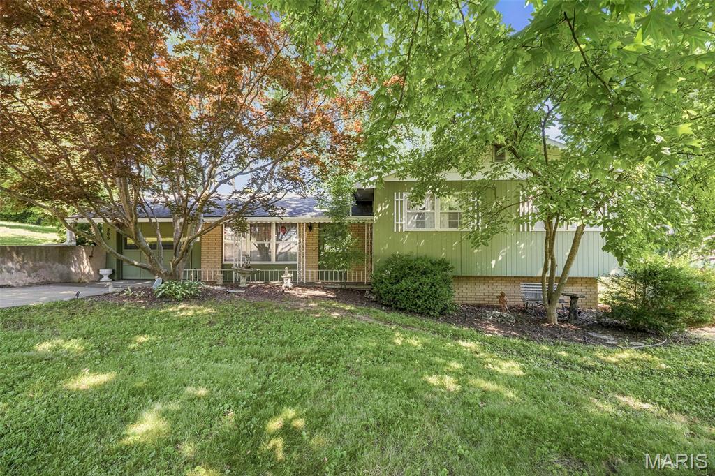 Adorable 3-bedroom, 1.5-bath split-level home offering comfort, convenience, and recent updates! This well-maintained property features beautiful hardwood floors, an attached garage, and a walk-out basement, providing plenty of storage and functional living space. The fenced backyard is perfect for pets, play, or outdoor entertaining, while mature landscaping adds charm and curb appeal. Major improvements include a new roof installed in 2025, an upgraded electrical panel completed in May 2025, and an HVAC system updated in 2012. Listed "As Is".