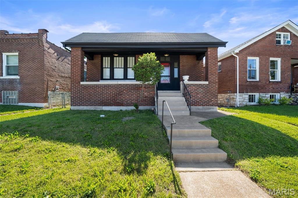OH! Hello There 6630 Elmer! It is always such a breath of fresh air to see a south city bungalow restored properly. She has 3 beds and 1 Bath of sweetness. With the period of build in mind the owners have kept her original details and added things to accentuate her best features! Like her oversized front porch for morning coffee and midwest storm watching. When you walk in find yourself charmed by the foyer and open floor plan with plenty of social space. All bedrooms are oversized and feature original wood doors. The bathroom is gorgeous and  has and abundance of storage space. You have an extra possible sleeping area in the basement with its own entrance. BUT WAIT this south city charmer has a garage too! You could scoop her up today!