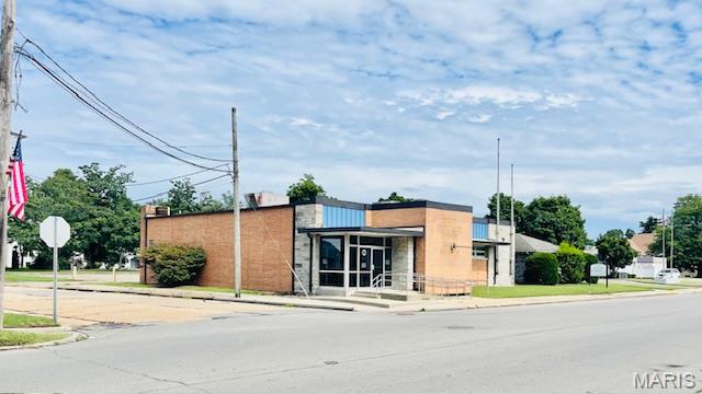 Commercial property in downtown Sikeston, 202 S Kingshighway is ready to be sold.  Building was last use as a Missouri State Unemployed Office and has a gross building area of 7,638 sq ft.  Property sits on a corner lot, has 15 parking places (2 handicap), handicap ramp at front entrance and a back entrance from parking lot.  On the main level, you will find a receptionist area,  large open space with several office cubicles (easily removed if not needed), two separate offices and 2 restrooms.  Located near the  reception area there is a set of stairs leading to the basement.  When entering the back entrance,  there’s a set of stairs and an elevator that lead to the basement.  Here’s where you will find the kitchen break room area, 2 restrooms, large conference room or office, storage and a spacious open area for cubicles if needed.  With the layout, location and square footage this property offers, making it endless purposes and business opportunities.