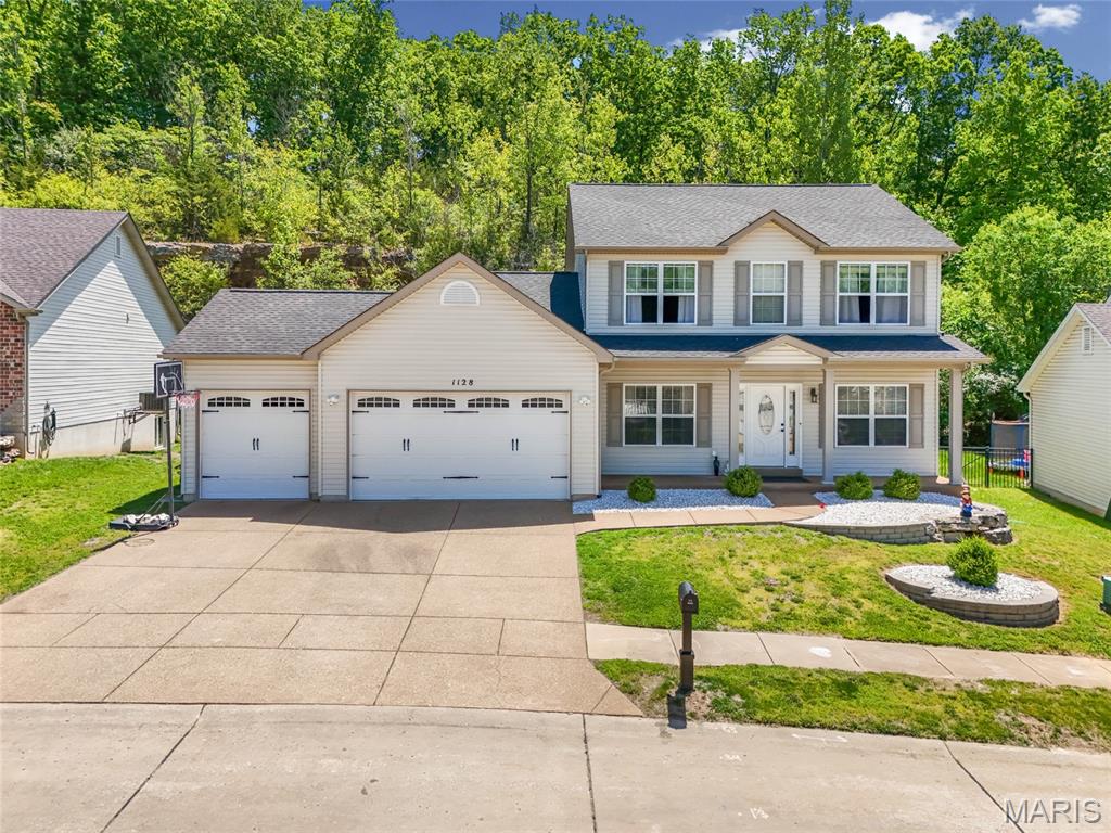 Luxury meets functionality in this spectacular move-in ready 4-bedroom, 3-bath two-story located in the sought-after Konert Farms community and popular Fox School District! Over 3,100 sq ft of living space, this show-stopping home offers exceptional curb appeal with professional landscaping, an aggregate driveway, and an oversized 3-car garage complete with a mini split system. Inside, you’ll find abundant natural light, newer flooring and trim, updated lighting and fixtures, and fresh modern paint throughout. The functional open layout is designed for both everyday living and entertaining. The spacious main-floor office with custom built-ins makes working from home effortless, while the formal dining room with coffered ceiling is perfect for hosting guests. The beautifully updated kitchen features quartz countertops, 42” cabinetry with crown trim, custom backsplash, under-cabinet lighting, stainless steel appliances including a newer dishwasher and stove (2025). Relax in the inviting great room showcasing a stone gas fireplace. Upstairs, the spacious primary suite offers vaulted ceilings and a luxury bath retreat with his and her walk in closets. The finished lower level, completed in 2023, provides additional living and entertaining space. Step outside to enjoy the large deck with a gazebo, newer front landscaping, and puppy picket aluminum fence—perfect for outdoor gatherings. Additional major updates include a brand-new roof (2025). This pristine, move-in-ready home truly has it all and is a must-see!