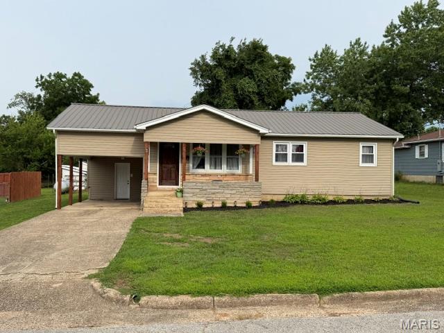 Charming and newly updated, this 3-bedroom, 1-bath home is situated on a spacious city lot and offers a welcoming blend of comfort and convenience. The eat-in kitchen features abundant counter and cabinet space, along with a pantry for added storage. A new exterior door provides access to the storage area, which leads directly to the carport. The kitchen also offers a convenient pass-through to the living room, and the electric glass-top stove and stainless refrigerator are approximately two years old. Natural light fills the living room through three windows overlooking the covered front porch. The laundry/mechanical room has washer and electric dryer hookup and a new electric hot water heater and is easily accessible from both the kitchen and living room, while the hallway leads to three bedrooms and a shared bathroom. Recent updates include all-new six-panel interior doors, luxury vinyl flooring throughout, and fresh paint. Home has an attached carport and concrete driveway, and the exterior has been recently power washed and enhanced with fresh landscaping. Schedule your showing today and come take a look!