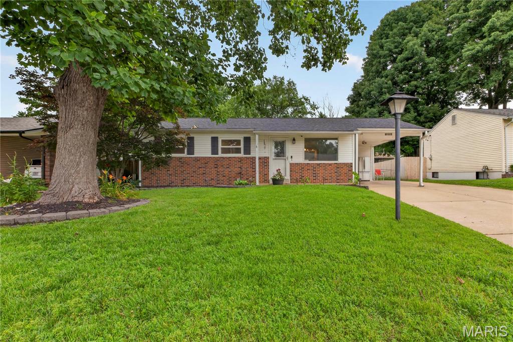 Welcome home to this beautifully updated, low-maintenance ranch in the heart of Maryland Heights! This move-in-ready home offers an inviting open floor plan filled with natural light and thoughtful updates throughout. Recent improvements include a new roof (2025), HVAC system (2024), and water heater (2026), providing peace of mind for years to come. Step inside to find updated windows, a decorative front entry door, six-panel white interior doors, fresh paint, and gleaming hardwood floors that extend through the living room, hallway, and bedrooms. The updated bathrooms feature tile flooring, newer vanities, and attractive tiled tub/shower surrounds. The spacious kitchen offers abundant cabinet storage, generous counter space, and tile flooring, making it perfect for everyday living and entertaining. Just off the kitchen, the bright and airy four-season room is surrounded by newer windows, creating the ideal space to relax and enjoy views of the backyard year-round. The partially finished lower level provides additional living space with a large family room, recreation area, and bonus office or flex room, offering endless possibilities for work, hobbies, or entertaining.
Outside, you'll find a patio perfect for gatherings, two utility sheds for extra storage, and ample parking with a carport and tandem concrete driveway. Combining comfort, functionality, and numerous updates, this exceptional home is ready for its next owner!
