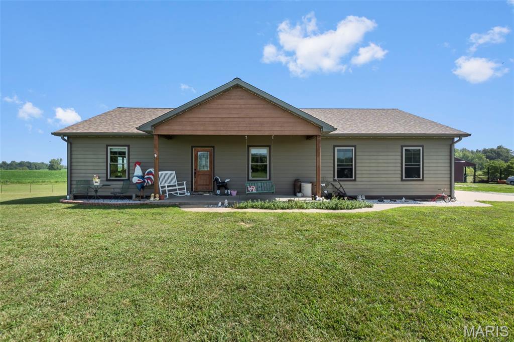 Escape the hustle and bustle and discover your own slice of country paradise! Nestled on 7.28 picturesque acres, this beautiful ranch home, built in 2019, offers the perfect blend of modern comfort and peaceful living. Whether you've been dreaming of a mini farm, room to roam, or simply more privacy, this property delivers. Inside, you'll find 2 bedrooms plus an additional downstairs room offering flexibility for a home office, guest space, or hobby room. The open-concept kitchen features a large island, oversized pantry, and stunning granite countertops that continue throughout the home. Enjoy the convenience of main-level laundry, two full bathrooms, and a walk-out basement leading to a relaxing patio overlooking your acreage. Outside, the outbuilding and existing fencing make this property ready for livestock, hobbies, or all your outdoor adventures. Country living has never looked so inviting!