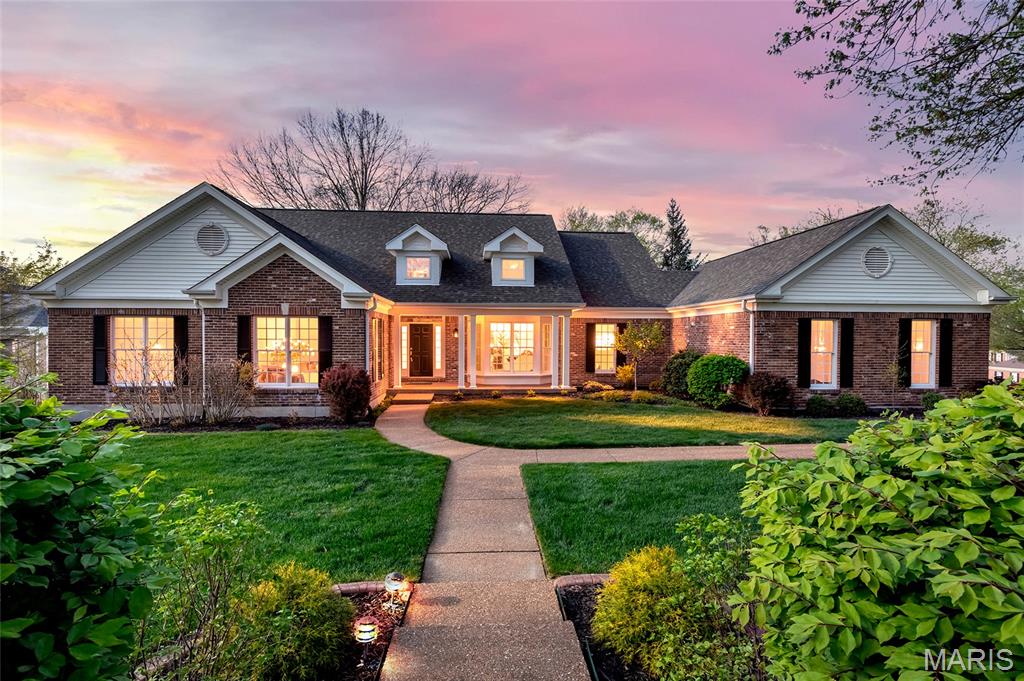 Welcome to 1201 Turnberry Ridge Court. Tucked in the sought after Wildhorse Village subdivision, this open concept 4 bedroom, 3 full and 2 half bathroom ranch style home offers over 4,500 square feet of pristine finished living space to enjoy. Impressive curb appeal and an inviting covered front porch create a welcoming first impression. Inside, a soaring entry foyer is flanked by a formal dining room with crown molding and bay window, and an elegant study appointed with french doors. The great room features vaulted, wood beamed ceilings, a gas fireplace and picture window with views into the kitchen. The expansive gourmet kitchen showcases an oversized center island, stone countertops, custom cherry cabinetry, stainless steel appliances, counter to vaulted ceiling windows over the kitchen sink and flows into an adjoining breakfast room with a window wall overlooking the backyard. A light filled sun room with custom built-ins offers easy access to the deck and patio. The primary suite features a bay window, vaulted ceilings, walk-in closet and luxe ensuite bath with dual vanities, whirlpool tub and separate shower. Two additional bedrooms are serviced by a full jack and jill bath. The main floor is complemented by a laundry room and two half baths for added convenience. The finished, walkout lower level provides a deep pour, spacious family room, an additional bedroom with a walk-in closet, a full bath and ample unfinished storage. Additional highlights include a 3 car oversized, side entry garage, newer HVAC systems, a wrap around deck and multiple patios, seamlessly nestled on a 0.5266 acre culdesac lot. Access to subdivision amenities including pools, tennis courts, walking trails and lakes. Located in the award-winning Rockwood School District, this home offers ease of living, proximity to amenities and a vibrant community. Extensive features list.