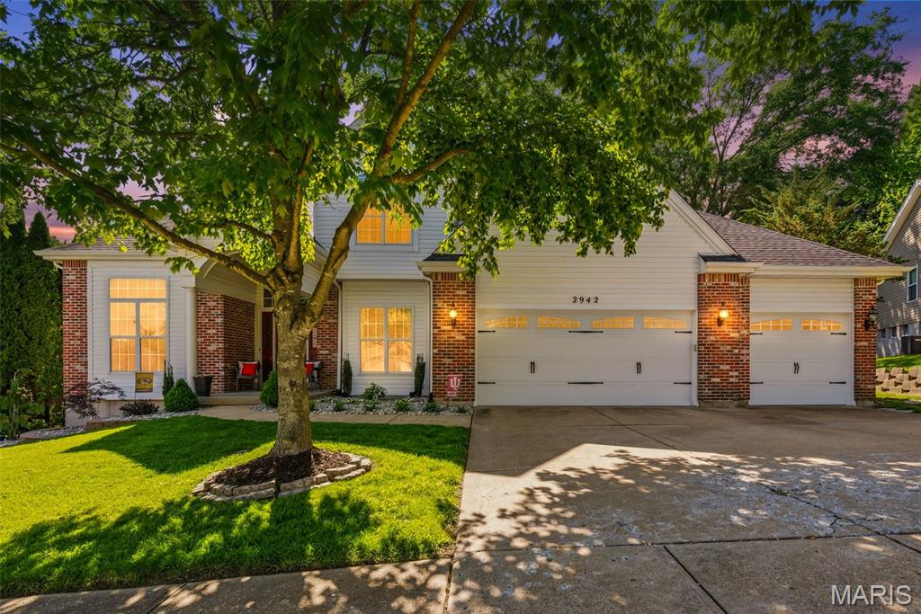 Welcome home to this custom 4 bedroom, 2 full AND 2 half baths, home in the heart of Oakville!   Attached 3 car garage, w/ workshop area too!  The beautifully landscaped home in front AND back borders a wooded area for privacy in a quiet neighborhood.   This spacious home boasts a 2-story entryway that showcases the t-staircase to upper level, 9 ft. main floor ceilings, 11 ft. ceilings in the office, double-sided gas fireplace and open concept living great for gatherings w/ friends & family. Main floor consists of office, separate dining room, large living room w/ double-sided gas fireplace into the spacious kitchen w/ center island and S/S appliances and joins the breakfast room; also has hearth room w/ dry bar and custom shelving. Convenient access to main floor laundry and to deck over looking your private backyard oasis complete w/firepit. Upper level consists of 4 bedrooms:  a spacious primary en suite w/ walk-in closet, and 3 additional bedrooms and hall bath. The finished lower level offers even more living space w/ a family room w/ gas fireplace, entertainment area, desk space, half bath and exercise room – not to mention 2 additional storage rooms. Did  I mention the walk -out basement to the lower-level patio area and backyard??? Wow!  When can you come tour the home this weekend??? Updates include: Roof, gutters & downspouts ’25, Water Heater ’24, 14 trees removed ’24, some main floor lighting, carpeting and more!! Close to Oakville Schools, Restaurants, shopping, and highways.