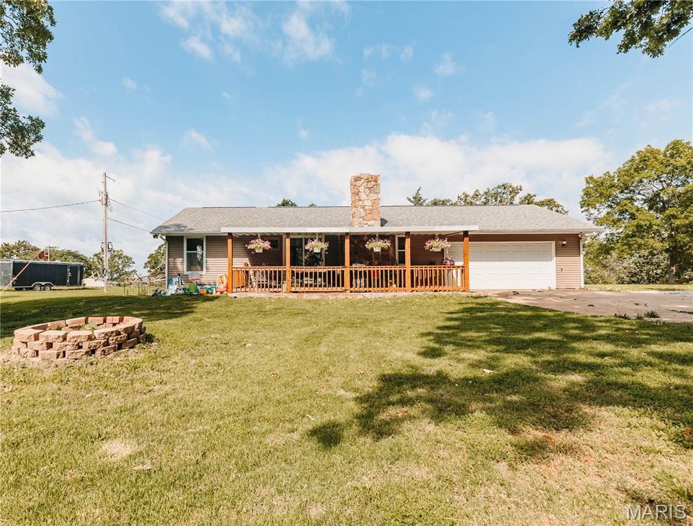 Full of charm, character, and thoughtful updates, this inviting 3-bedroom, 2-bath home offers the perfect blend of comfort, space, and convenience on 1.5 beautiful acres!
Step inside to an open main living area featuring vaulted ceilings and a beautiful stone fireplace that creates a warm focal point extending into the dining space. This home is move-in ready while still offering plenty of opportunity to add your own personality.
Start your mornings with a cup of coffee on the large covered front porch, where peaceful wooded views and frequent wildlife sightings create the perfect place to relax, unwind, or entertain guests. Out back, you'll find a fenced yard ideal for pets, play, or gardening, along with an equipment shed that provides excellent space for storage, hobbies, or projects.
Need extra space? The unfinished basement offers endless potential for storage, a workshop, future living space, or whatever fits your needs. Additional features include a 2-car garage and plenty of room both inside and out to make yourself at home. Conveniently located just 5 minutes from local restaurants, a coffee shop, grocery stores, parks, and a golf course, with an easy commute to Fort Leonard Wood, St. Robert, and Rolla.
This is the kind of home that combines peaceful country living with everyday convenience—don't miss your chance to see it!