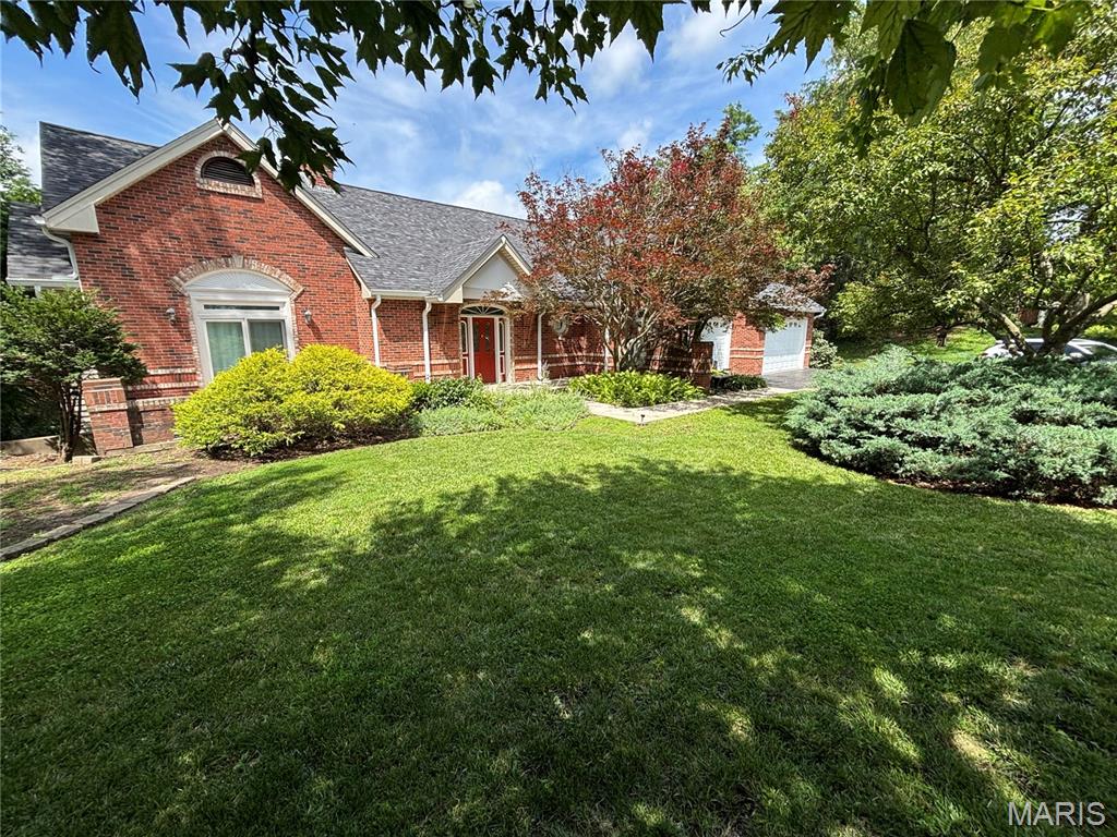 LOVELY atrium ranch home in the highly desirable Wild Horse Bluff subdivision situated on a sprawling, secluded, LEVEL to sloping, 3+/- acre lot surrounded by mature trees. This custom home offers a private country feel just minutes from ample amenities & a SPECTACULAR view of the Chesterfield Valley, which is a must see! 4 Bedroom, 4 full bath home featuring 4,288+/- SqFt, 9’+/- ceilings & job-finished wood flooring through most of main level. Partially covered, expansive, flagstone front porch greets you as you step inside the entry foyer. Living room boasts a 14’+/- vaulted ceiling, wood burning fireplace & a wall of windows allowing plenty of natural light. Kitchen offers custom cabinetry, coffered ceiling, center island, breakfast bar, tile backsplash, pantry & butler’s pantry w/prep sink. Breakfast room features a 12’+/- vaulted ceiling & a bay window w/wall of windows. Primary suite with carpet, 14’+/- vaulted ceiling, large custom walk-in closet & ensuite full bath with French door entry, tile flooring, shower w/glass door, double single sink vanity, jet tub & private commode. Additional main level bedroom with carpet, slide closet & shares hall bath with a shower/tub & single sink. Office, dining room, sitting room, & laundry closet completes the main level. Walk-out lower level extends living quarters that feature a family room with a wood burning fireplace, wet bar, built-in bookcases, indoor atrium & a sliding glass walk-out to lower deck. 3rd & 4th Bedroom w/large walk-in custom closets & 1 w/ensuite bath, other shares hall bath. Unfinished utility room for additional storage space. Outside, enjoy an AWESOME level/gently rolling fully fenced-in backyard, FABULOUS/spacious upper & lower level wood decks, PERFECT for family gatherings, & a 3-car attached garage. More photos coming soon! :)