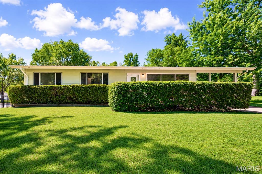 Charming 3-bedroom ranch in the heart of St. Charles, tucked away in a quiet, established neighborhood. This move-in ready home features brand-new flooring throughout and an open-concept layout filled with natural light, creating a warm and welcoming atmosphere. The spacious living room flows seamlessly into the kitchen, which offers classic cabinetry and a stainless steel refrigerator. The main level includes three comfortable bedrooms, a full bathroom, and a convenient half bath in the primary bedroom. Enjoy easy access to Historic Main Street, local parks, shopping, restaurants, and schools, all just minutes away. Combining comfort, character, and an unbeatable location, this St. Charles gem is ready to welcome you home.