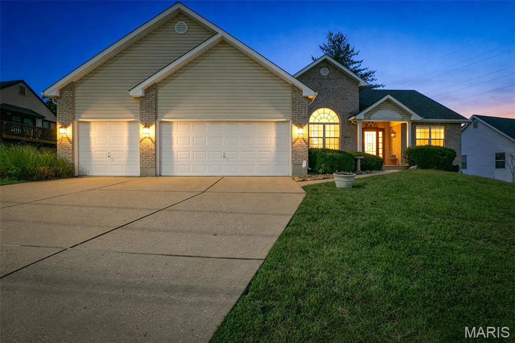 Location, Location, Location!! You will want to see this immaculate ranch, where pride of ownership shines from the moment you arrive. Meticulously maintained and lovingly cared for, this stunning 3-bedroom, 2-bath home offers the perfect blend of comfort, functionality, and opportunity in one of the area's most sought-after locations.

Step inside to discover an inviting open floor plan accentuated by soaring vaulted ceilings, creating an airy and welcoming atmosphere throughout the main living spaces. A quaint foyer greets you upon entry, flanked by a spacious dining room that's perfect for hosting family gatherings and holiday celebrations.

To one side of the home, you'll find two generously sized bedrooms connected by a well-appointed full bathroom. The heart of the home is the expansive living room, complete with a cozy gas fireplace and a custom entertainment center that anchors the space beautifully.

The kitchen is truly a standout feature, boasting gorgeous soapstone countertops, custom cabinetry, a bar, and an adjoining breakfast area overlooking the backyard. Just beyond the walkout, you'll discover a maintenance free composite deck—the perfect place to enjoy your morning coffee or unwind after a long day while taking in the fully fenced, level backyard.

The thoughtfully designed main floor also offers a convenient mudroom/laundry room with direct access to the 3-car garage. Tucked away for privacy, the spacious primary suite is sure to impress with its oversized walk-in closet and private bath featuring a double vanity and walk-in shower.

Downstairs, the unfinished walkout basement offers incredible potential for future living space and instant equity. With abundant egress windows and a functional layout, it's ready for your vision to come to life.

For years, this home has been filled with love, laughter, and cherished memories. Now, it's ready for its next chapter and searching for the family who will make it their own!