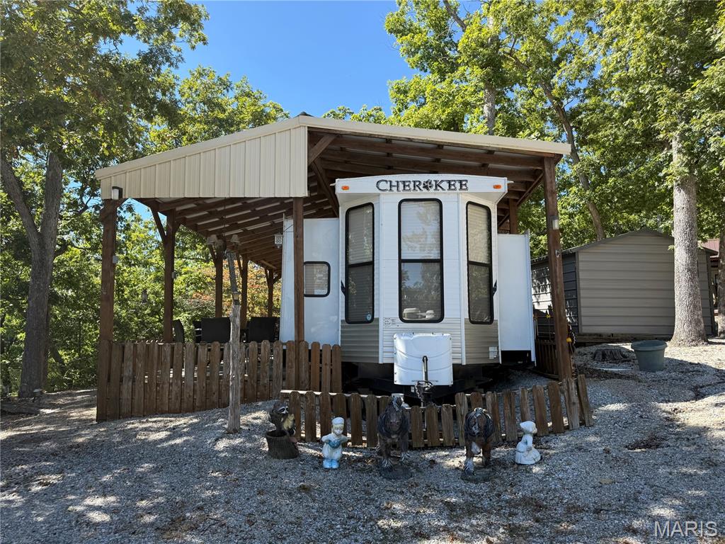 "Find your escape in the great outdoors."  Lakeview property located in Dogwood Lakes Campgrounds
 Comes with a Beautiful 2012 Cherokee Travel Trailer, very well cared for.
39 Ft with 4 Bump outs
50 Amp Service
1000 Gal Holding Tank
Two Roof A/Cs
Luxury Interior Fireplace
Beautiful Steel Porch
Two Sheds
You don't want to miss this, this premium property is seldom available as it is on the big lake.