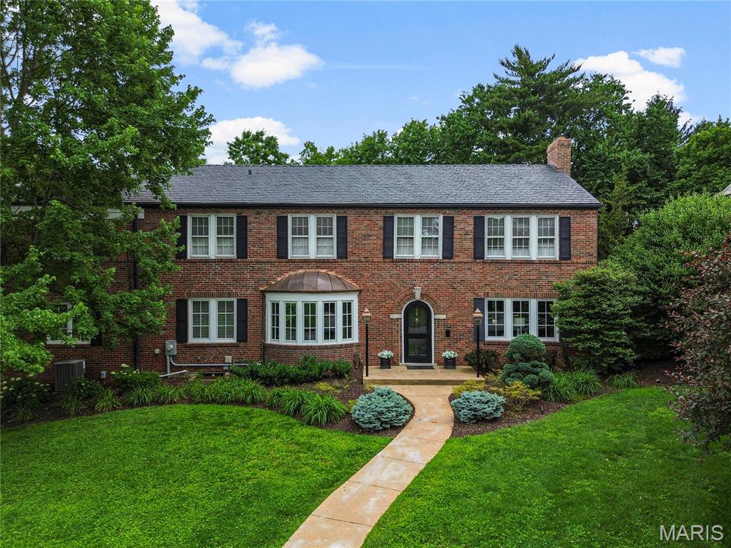Timeless Colonial elegance meets modern comfort in this beautifully appointed home on an interior street in the Lake Forest neighborhood. Expansive living areas and classic architectural details create the perfect blend of sophistication and warmth. The show-stopping gourmet kitchen commands attention with a dramatic 10’ island, dual Sub-Zero refrigerators, and a 48” Wolf double oven range. With a Wolf microwave, warming drawer, and Scotsman icemaker, this kitchen has it all! A brilliant added touch is the Accordion glass door that opens wide to the resort-style backyard and allows for indoor-outdoor living and entertaining. Whether hosting a large gathering or enjoying a quiet pool day, you will crave spending time outside in this oasis. Adjacent to the kitchen is a family room for cozy gatherings and movie watching. On the west side of the house is a classic sunroom - an energizing space with a tiled floor, windows on all sides, and a French door to the patio. The primary suite is thoughtfully set apart, offering a tranquil escape with ideal privacy. Two of the bedrooms share a hall bathroom and the third has its own ensuite - it was the original primary bedroom when the house was built. Recent upgrades: new kitchen 5 yrs, Pella accordion door, Hunter Douglas motorized shades, 1st floor Pella windows,  4 yr old architectural shingle roof, new concrete driveway. This is truly a lifestyle property located in one of the most iconic neighborhoods of the Central Corridor - an enclave in the heart of it all!