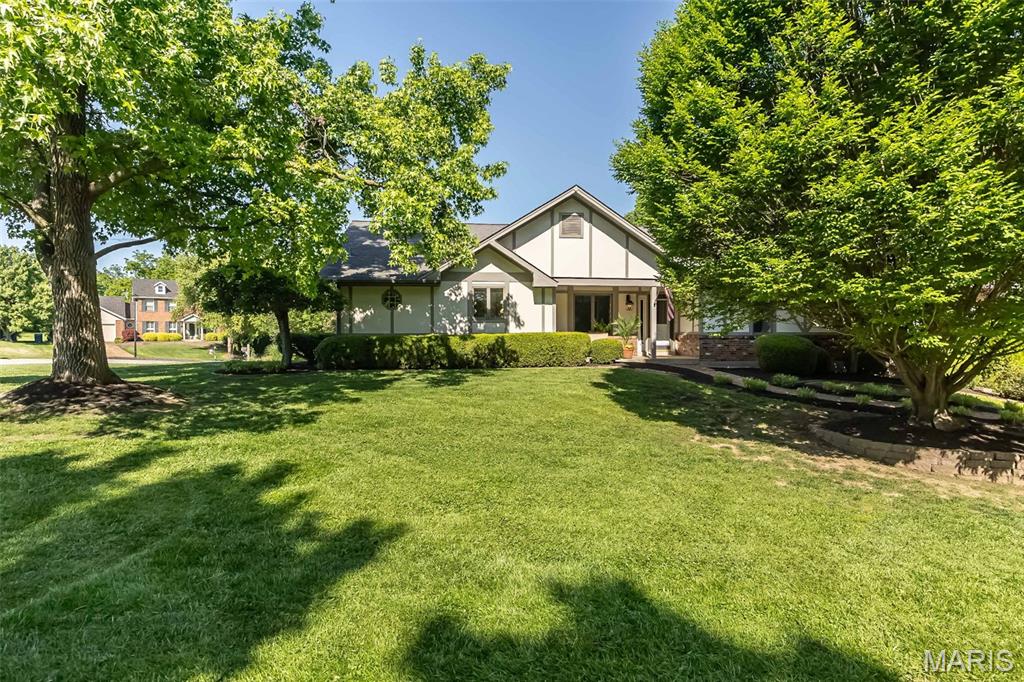 Stunning ranch home offering 3,000+ sq ft of beautifully designed living space on a premium .32-acre corner lot in the highly sought-after Cedar Valley Subdivision. This move-in ready home features a highly desirable open-concept floor plan with exceptional indoor-outdoor living designed for entertaining on any scale. Fresh landscaping, new mulch, and a charming paved walkway create inviting curb appeal leading to the covered front sitting porch. Step inside the welcoming private foyer and immediately notice the bright, airy layout, gleaming hardwood floors, elegant millwork, and abundant natural light throughout.
The formal living room showcases a tray ceiling and custom finishes while seamlessly flowing into the chef-inspired kitchen featuring an abundance of white cabinetry, spacious pantry, coffee bar niche, counter seating, and sunny breakfast area with oversized picture window and crown molding. The impressive rear addition creates an expansive gathering space complete with skylights, custom built-ins, and French doors opening to a massive entertaining deck overlooking the oversized yard. The stunning double-sided all-brick fireplace adds warmth and character while connecting multiple flexible living and dining areas. The spacious backyard offers endless possibilities for a dream pool, outdoor kitchen, firepit lounge, or future outdoor oasis. A private home office with French doors, built-in desk with shelving and storage drawers provides the perfect remote work setup. Convenient main-floor laundry room is tucked just off the kitchen for everyday functionality. Retreat to the luxurious primary suite featuring dual walk-in closets and a spa-like en suite bath with soaking tub, separate shower, double vanity, makeup station, and private deck access for peaceful morning coffee or evening relaxation. Two additional main-floor bedrooms share a beautifully appointed full bath. The finished walkout lower level expands your living space with a cozy recreation room featuring built-ins and sliding glass doors leading to a secluded patio. An additional flex room with egress window, planning desk, and nearby oversized walk-in closet offers the perfect opportunity for a 4th bedroom, guest suite, hobby room, or second home office. Additional highlights include an oversized rear-entry 2-car garage, extended parking pad, flexible multi-generational layout, abundant storage, and incredible entertaining spaces inside and out. This exceptional property combines timeless craftsmanship, modern functionality, and the lifestyle today’s buyers are searching for.