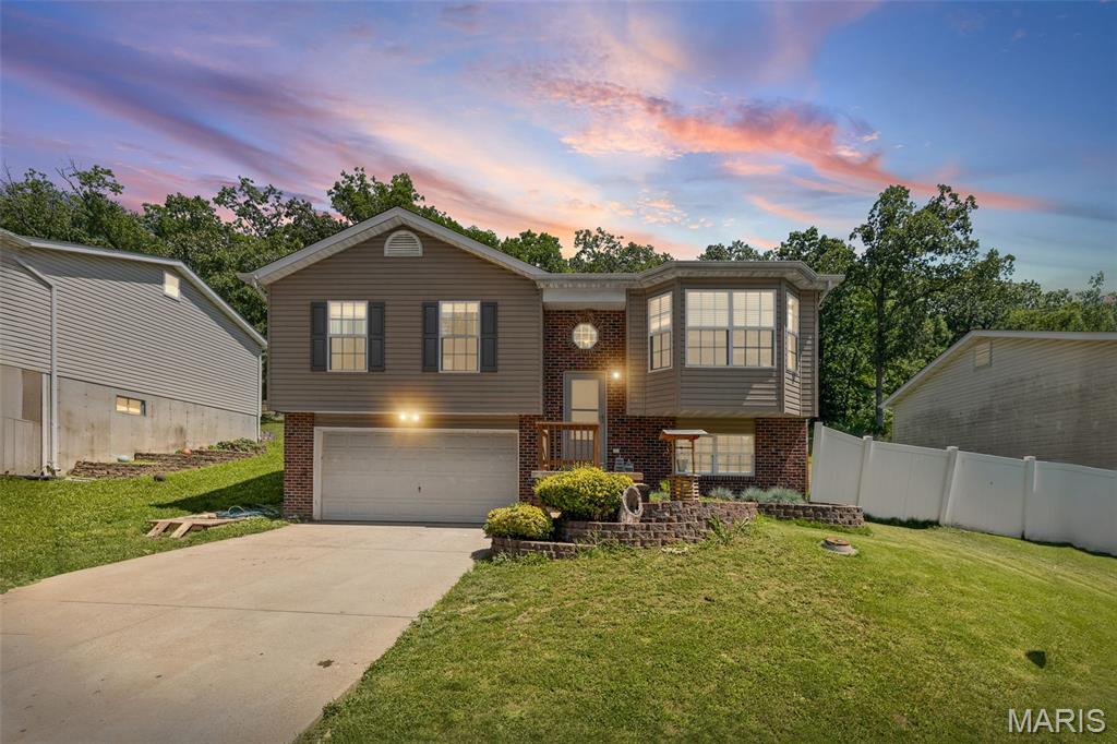 Some homes just work, and this one is a great example. This 4-bed, 2-bath split foyer in Pineview Acres has a layout that makes sense from the moment you walk in, and the current owners have spent years making it better. Brand new flooring runs throughout the entire main level, and updated light fixtures in the kitchen and hallway give the space a fresh, finished feel. The eat-in kitchen comes stocked with appliances that are only two years old, and a newer garbage disposal means the little details have been taken care of too. The primary suite features a newly replaced vanity in the bath, along with a replaced door, and both bathroom doors have been updated as well. Downstairs you'll find a generously sized fourth bedroom with a walk-in closet, perfect for guests, a teenager who wants their own space, or a home office that finally has room to breathe. The 2-car garage and dedicated laundry area keep the everyday logistics tucked away. Out back, a 16x16 deck was added for outdoor living, the fenced yard gives you privacy, and a French door replacement two years ago makes the transition from inside to outside feel intentional. The front porch railing has been replaced, and a new roof tops it all off. Well maintained doesn't begin to cover it. Zoned for Fox School District and Seckman High. Come see it before someone else does.