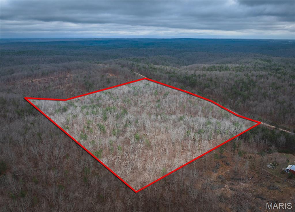 Beautiful 16.01 acres of wooded vacant land located in the Golden Hills Equine Community in Raymondville, MO, offering privacy, natural beauty, and endless possibilities. This heavily wooded tract provides a peaceful setting with abundant wildlife, making it perfect for a private homesite or recreational getaway. Enjoy the tranquility of the Ozarks while still having convenient access to nearby towns and amenities. Golden Hills is designed with horse owners and outdoor enthusiasts in mind, featuring trail easements throughout the community. This parcel offers the perfect setting for a walk out basement for private access to mother-in-law quarters, or a patio perfect for social gatherings.  Whether you are looking to build your dream home, create a weekend escape, or invest in land, this property offers a wonderful opportunity to enjoy country living with room to roam.