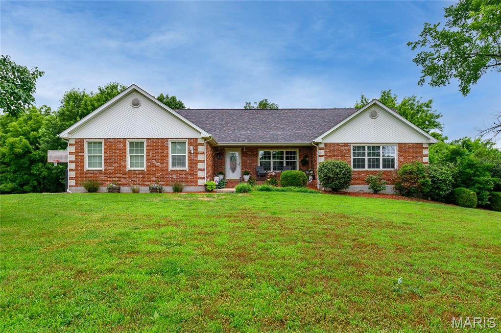 From the moment you pull down this quiet, no-thru street, the pride of ownership throughout the neighborhood is unmistakable. Boasting beautiful curb appeal, a welcoming covered front porch, and manicured landscaping, this home embraces you before you even step through the front door.

Inside, the main level offers the effortless comfort of ranch-style living, flowing seamlessly into a fully finished walkout basement. This lower level is bound to become the heart of the home—imagine cozying up by the propane fireplace for family movie nights, or utilizing the extra bedrooms for guests, a hobby room, or a dedicated home office. With space split so well, there is plenty of room for everyone to find their own corner to unwind.

The real magic happens when you step outside. Backing up to a lush, wooded tree line, your backyard feels like a private, serene sanctuary. Whether you are hosting weekend barbecues or enjoying a quiet morning coffee, the view brings a feeling of pure peace. Best of all, the Primary Bathroom floor was remodeled June 2026, and the above-ground pool features a brand-new vinyl liner (June 2026), making it completely ready for summer fun!

Perfectly located under 20 minutes from Fort Leonard Wood, this isn’t just a house—it’s the backdrop for your family’s next chapter. Schedule your tour today and come feel it for yourself!