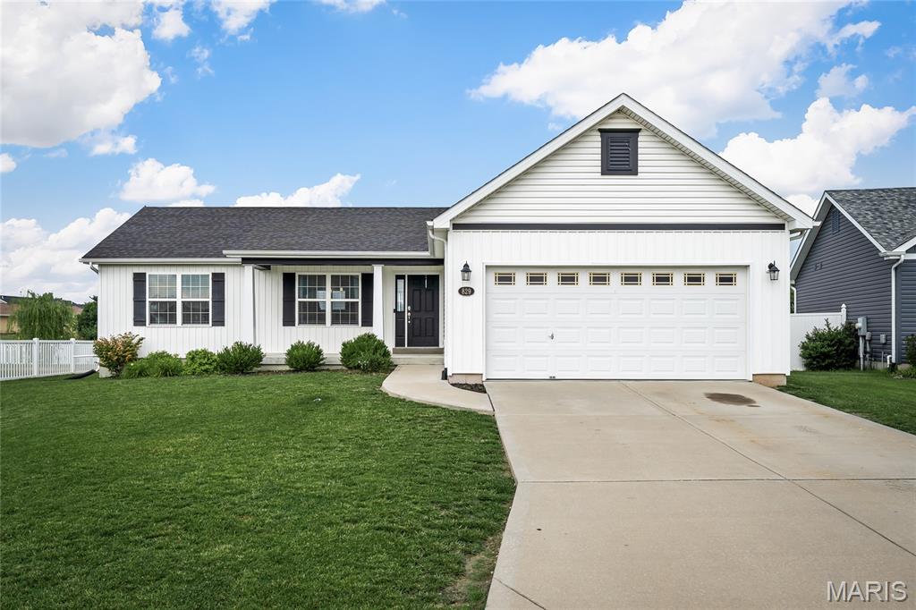 Charming Ranch with Modern Farmhouse Style! The front exterior showcases the popular black-and-white farmhouse look, giving this home incredible curb appeal. Inside, you’ll love the open floor plan with vaulted ceilings, easy-care laminate flooring, and a gorgeous kitchen featuring soft-close white cabinetry, granite countertops, and a walk-in pantry. Main-floor laundry adds convenience, and the level backyard is perfect for outdoor enjoyment. The lower level offers an egress window for a potential 4th bedroom plus a rough-in for an additional bath, making future expansion easy. Located within walking distance to schools, this home blends style and functionality. Passed occupancy inspection to be provided for buyer's piece of mind.