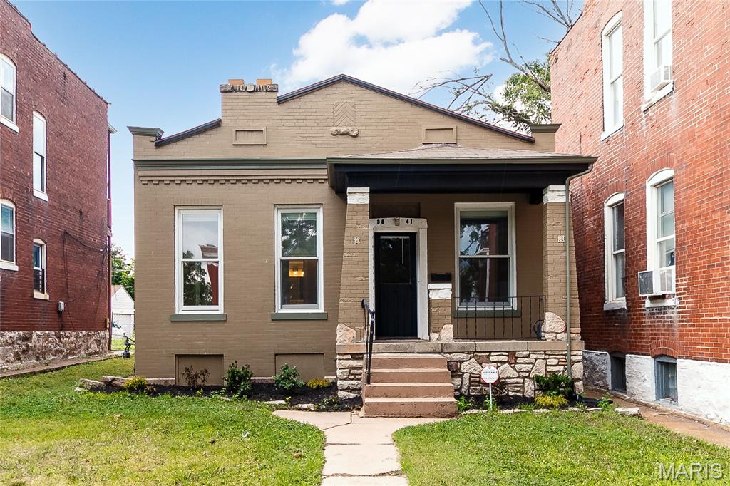 Charming All Brick Bungalow in South City! step into timeless character with this all-brick charmer, where classic craftmanship meets everyday comfort. Rich, exposed beamed ceilings add warmth and architectural interest throughout. while the solid brick construction speaks to the quality of a bygone era. Inside, you'll find that unmistakable historic charm-thoughtful details. updated Kitchen, some new appliances, new laminate flooring, and a layout that flows with character you just can't replicate in new construction. It's the kind of home that tells a story the moment you walk through the door. Don't hesitate, This property is a perfect first home or if you are downsizing. parking off alley in rear with a large security fence.