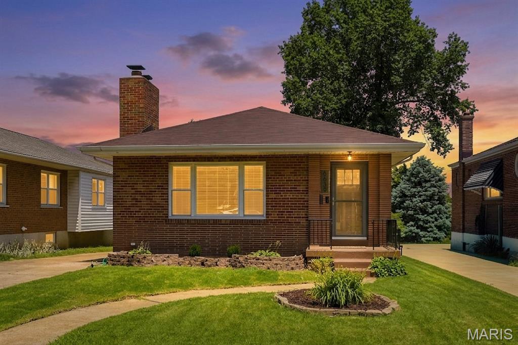 A striking mid-century brick ranch home in a fabulous Lindenwood Park location. Enter through the stunning front door to see the open floor plan from the spacious living room to the dining room, kitchen and open stairwell to the finished basement. Incredible natural light and recessed fixtures light up the space. Gleaming hardwood floors throughout - no carpet here! Kitchen is all new featuring crisp white cabinets, subway tile backsplash, quartz counter and stainless appliances. Island stays too! Main floor full bath has updated tile flooring, shower surround and vanity. So many hard-to-find features for the neighborhood including 3 spacious main level bedrooms with ceiling fans, closets galore and an awesome flex room in back surrounded by windows. It's an ideal home office, family room or kids play space. The finished basement offers even more living space with a huge recreation room, sleeping area, 2nd FULL bath and separate laundry area. 
Private front entry driveway leads to the huge oversized 2 car garage with 220 outlet, landscaped yard and patio. Refrigerator, washer and dryer are included. System updates include: roof '22, electric panel and wiring, PVC plumbing,  AC '24 and a Whole House Generator. No power? No problem, this things keeps everything up and running during outages.  Just a hop skip and a jump to the park for Sunday concerts, and some of St. Louis' best restaurants-Farmhaus, Trattoria Marcella plus quick and easy access to highways. This one is a must see.