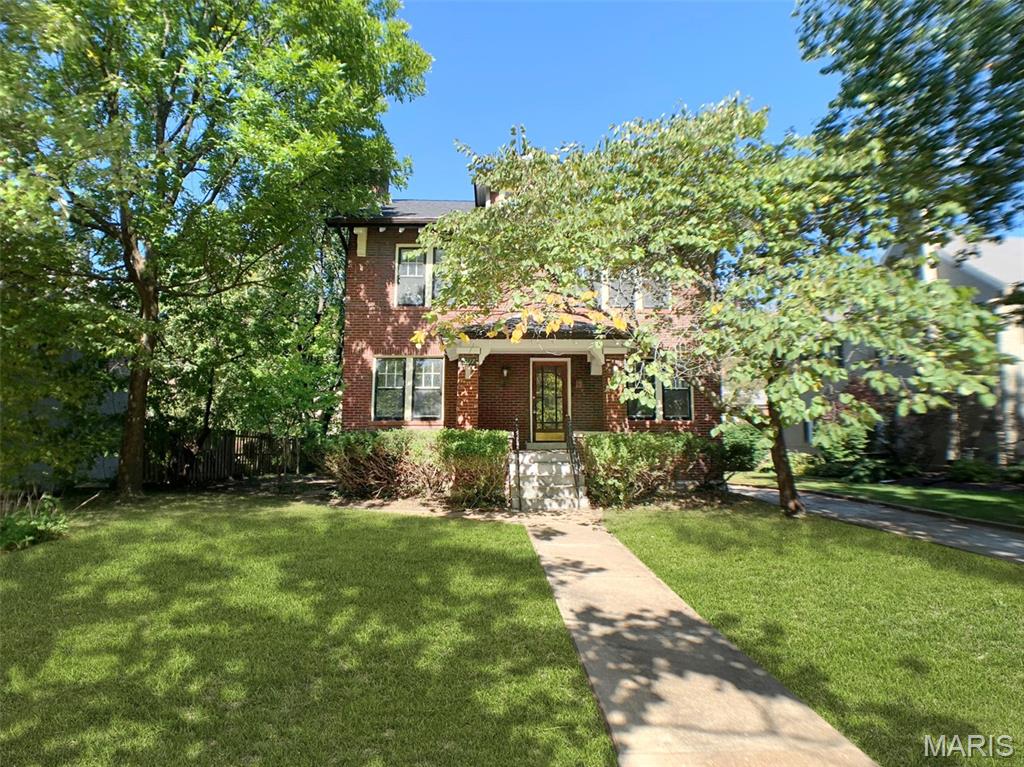 Discover the perfect blend of historic soul and modern luxury in this 4-bedroom, two-story brick residence. Completely renovated in 2018, the home welcomes you with spacious formal rooms featuring classic arched doorways, stained glass, and a charming fireplace. The chef’s kitchen is a standout with custom cabinetry, stainless steel appliances, and a butler’s pantry, flowing seamlessly into a large family room. Upstairs, the primary suite features its own fireplace, while a bonus attic offers endless potential. Nestled just three houses from Historic Lewis Park, you are steps away from Washington University and the vibrant Delmar Loop.