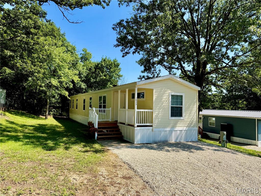 Freshly updated 2019 Manufactured Home. Move in ready! New flooring throughout! New Deck! New Skirting too! This wonderful floor plan features a large living room, spacious kitchen with an Island bar, 3 large bedrooms too! The Primary Suite is not only spacious but also features its own full Bath ensuite and an enormous closet. You will enjoy your new laundry room too! Make no mistake, you will not find another home this size (over 1200SF) and in this condition, for this price. Come have a look!