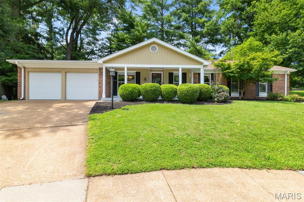 Welcome home to this beautifully updated ranch in the highly desirable Old Farm neighborhood, offering approximately 3,000 square feet of thoughtfully designed living space. A welcoming foyer opens to a light-filled, open-concept floor plan enhanced by gleaming refinished hardwood floors and fresh neutral piant throughout.The stunning kitchen has been completely updated with 42-inch white shaker cabinetry, granite countertops, a designer tile backsplash, and a full suite of stainless steel appliances. Both bathrooms have been tastefully renovated with stylish tile, new vanities, contemporary fixtures, and elegant finishes. The inviting family room features a cozy fireplace, custom built-in bookshelves, and peaceful wooded views, with direct access to the expansive patio—perfect for relaxing or entertaining. Additional updates include new interior doors, modern lighting, and stylish finishes throughout the main level.The finished lower level offers exceptional additional living space, complete with new carpeting, a spacious family and recreation area, a dedicated workshop, and a pool table that stays with the home. Enjoy the outstanding amenities of Old Farm, including the neighborhood pool, access points to Creve Coeur Lake & Mallard Lakes that connects to the Katy Trail along with a community garden to grow your own food! Located in the award-winning Parkway School District, this exceptional home offers convenient access to major highways and is just minutes from shopping, dining, parks, schools, and the outdoor recreation!
