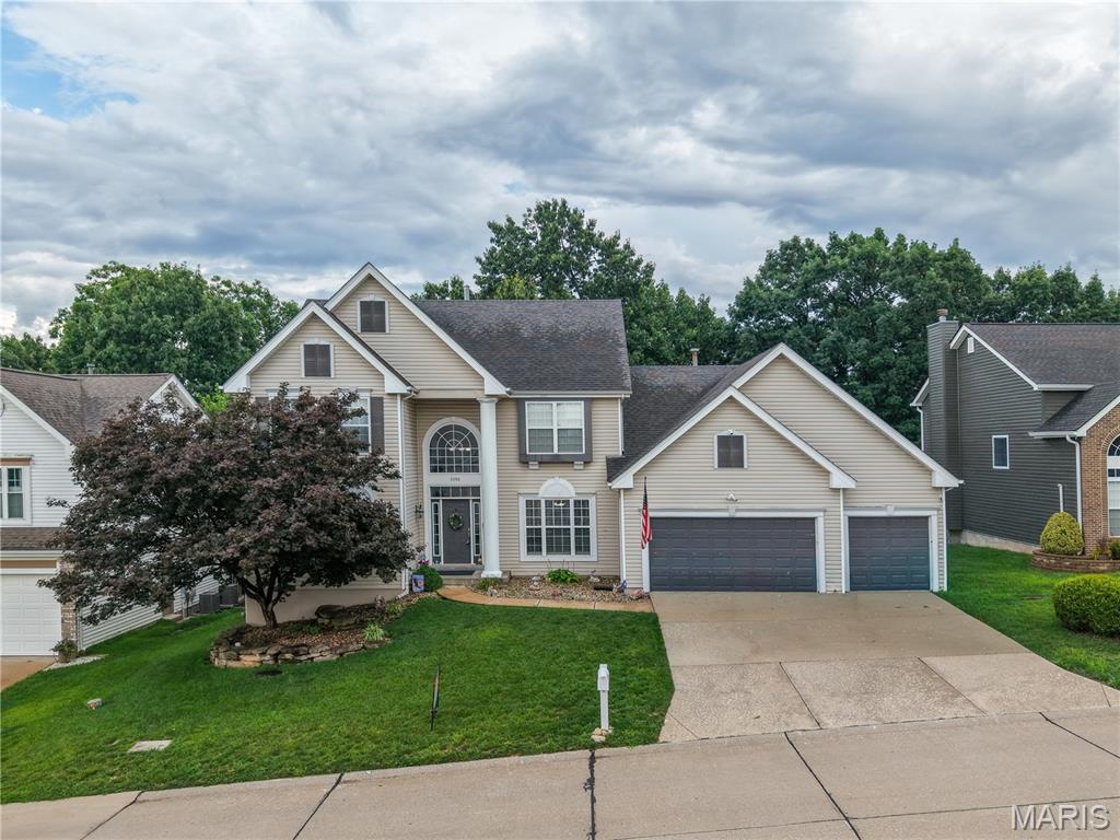 NO SHOWINGS UNTIL 7/17/26. 
Interior photos will be available no sooner than the evening of 7/16. 
Welcome home to this spacious, beautifully designed 5-bedroom, 3.5-bath residence offering over three finished levels of comfortable living space with a main floor master ensuite making it a true 1.5 story home. From the moment you step through the impressive two-story foyer, you'll appreciate the home's open feel, elegant architectural details, and practical layout. The heart of the home features a breathtaking two-story fireplace wall adorned with custom built-in shelving, creating a magazine worthy gathering space. Coffered ceilings formal dining room, eat-in kitchen, multiple bay windows, and abundant natural light add character and charm throughout the home. The main-floor primary suite provides a private retreat with a spacious ensuite bath, walk in closet and bay window making everyday living both convenient and luxurious. The kitchen and living areas flow seamlessly and provide access to the rear deck, while the attached three-car garage has room for vehicles, hobbies, and storage. Upstairs are 3 generously sized bedrooms with large closets and Jack-and-Jill full bath. The finished basement expands the living space with a large family room, dedicated storage area, game area ( some games stay)and a fifth bedroom that could easily serve as a secondary primary suite thanks to a private full ensuite bath-perfect for multi-generational living, guests, or a private home office. Outside, enjoy a level, fenced yard that backs to mature woods, creating a peaceful and private setting for relaxation, play, or entertaining. Located in a sought-after subdivision featuring a community pool, clubhouse, and numerous neighbor-friendly events throughout the year, this home offers the perfect combination of space, privacy, and amenities with a short drive to, HWY 30 access, The Bluffs or even I-55.