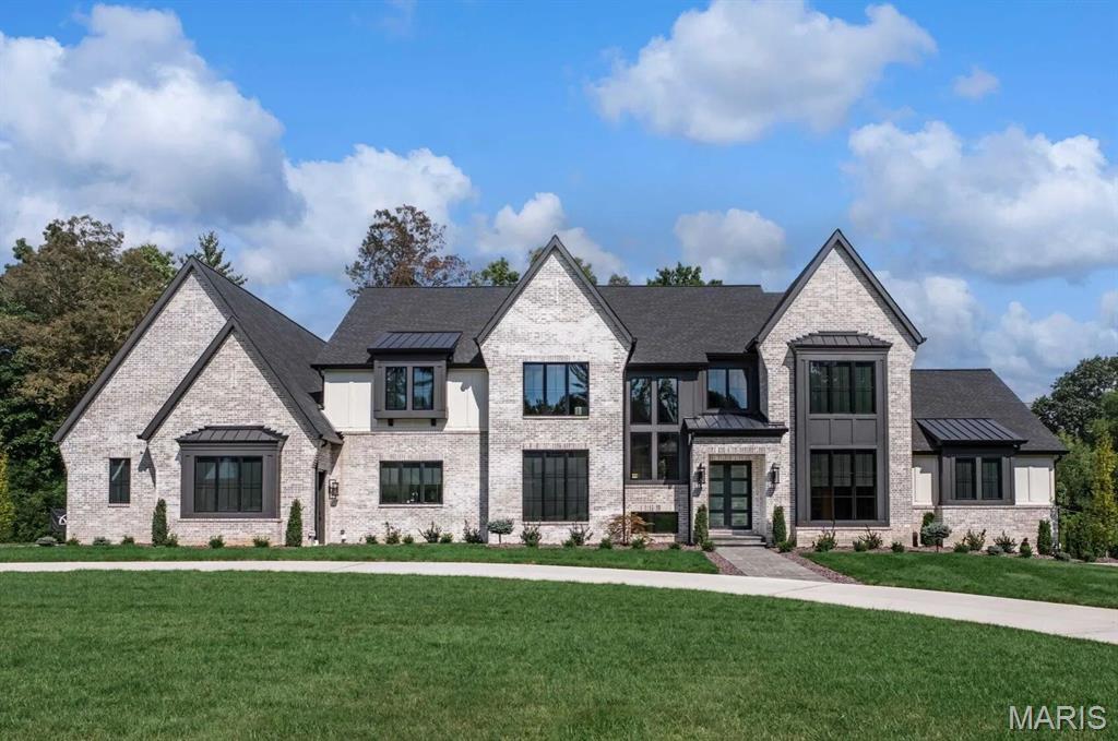 Ballas Ridge – An Exclusive Custom Home Enclave in Des Peres. Limited to just 4 estate-sized homesites (1.6–6.5 acres), this private community offers a rare opportunity to build with Kemp Signature Homes. Featured TBB plans include the Nottingham II Ranch (MLS #25057780), Hawthorne (MLS #25057833), Hawthorne II (MLS #25057813), Roclare II (MLS #25057850), and Westchester IV (MLS #25057846)—each offering expansive luxury living, refined finishes, and optional lower levels. Buyers may also design a fully bespoke residence tailored to their lifestyle. Lot 1 is reflected in the base pricing. Surrounded by mature trees, rolling terrain, and a scenic pond, Ballas Ridge combines unmatched privacy with convenience—just minutes from top schools, fine dining, boutique shopping, hospitals, parks, and major highways. This is Hawthorne under contraction phase 1 lot 2 sold.