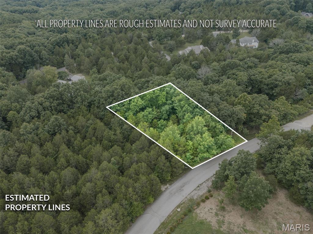 Does your family love to go boating, swimming, or fishing? Raintree offers 4 lakes to choose from! This particular lot is just a walk down the road from Spring lake, the second largest lake in the community. If you are thinking about building your next home and are looking for land to build on, this lot is ready for your builder and plans, offering a gentle slope and privacy. It would be a great space for your next project. Public connections are at the street and Raintree requires a one time tap on fee. If golf is more your style, Raintree's golf course offers ample fun for all ages. The country club is a mandatory membership offering country club privileges that your family will enjoy.