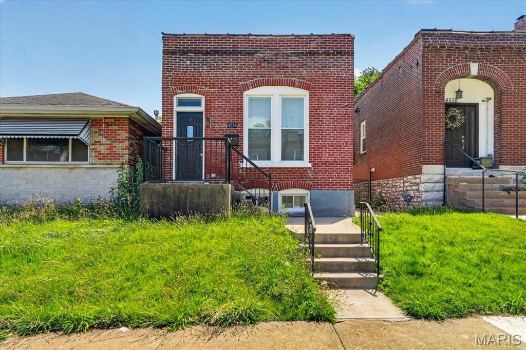 Step inside this beautifully updated all-brick bungalow where timeless character meets modern living! Featuring 2 bedrooms and 2 full baths, this home is filled with charm from the exposed brick walls to the stylish finishes throughout. The open, inviting floor plan is perfect for everyday living and entertaining. The updated kitchen offers plenty of cabinet space, stainless steel appliances, and flows seamlessly into the living and dining areas. You'll love the convenience of main-floor laundry,  the spacious primary suite complete with its own private bath and ample storage in the basement. With thoughtful updates throughout while maintaining its original character, this move-in ready home is the perfect blend of classic South City charm and modern comfort. Conveniently located near parks, restaurants, shopping, and everything South St. Louis has to offer, this one is ready to welcome you home!
