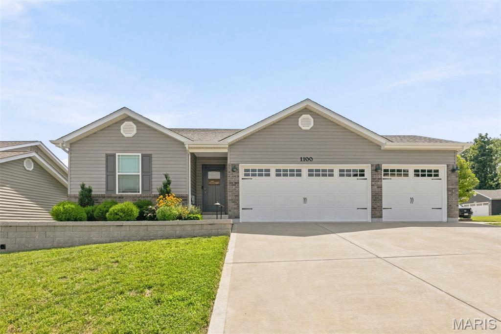 Almost new, stunning ranch home on a corner lot is ready for you to call home. This home has almost every upgrade imaginable!  3 beds, 2 full baths, open floor plan with vaulted ceilings, taller baseboards, rounded corners, wide plank luxury vinyl flooring and plenty of recessed lighting. The spacious kitchen features 42" soft-close custom maple cabinets, granite countertops, stainless steel appliances, breakfast bar and dining area. Sliders off the dining area take you to a huge patio, large fenced-in backyard with gorgeous professional landscaping and beautiful perennial flowers.  Corner lot!  The large Primary Bedroom Suite has a walk-in closet, double sink vanity with marble top, luxury whirlpool tub and separate shower.  Oversized 3 car garage with upgraded carriage doors, extra 100 AMP panel, fully insulated and finished with drywall.  Basement is partially finished, with roughed in bathroom and egress window.  Partially finished basement with rough-in for 3rd bathroom is awaiting your finishing touches.   Walking path to Indian Camp Creek Park.