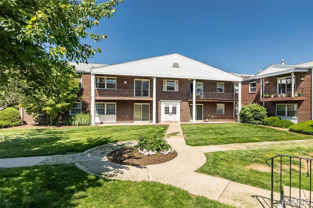 Stylishly Renovated Condo in the Pattonville School District — Move-In Ready! Main Floor Living! From the moment you step inside, this fully updated 2-bedroom, 2-bath garden-level condo feels like home. Rich luxury vinyl plank flooring and crown molding flow throughout, lending a polished, cohesive look to every room. The open-concept living and dining area is made for gathering — whether you're having a family dinner or entertaining guests, this space is perfect. The thoughtfully designed kitchen is the heart of it all, featuring stainless steel appliances, gleaming granite countertops, and a stone backsplash. A moveable island adds flexible prep space, while an entire wall of cabinetry ensures you'll never run out of storage. Both bedrooms are exceptionally spacious — a rare find in condo living. The primary suite offers a private ensuite bath with a shower/tub combo, while the well-appointed hall bath sits conveniently beside the dedicated laundry area, complete with a stackable washer and dryer already in place. When it's time to unwind, take it outside — the community pool and clubhouse are the perfect retreat. And with easy access to top shopping, major highways, and nearby parks, everything you need is right at your fingertips. Condos like this don't last — schedule your showing today!