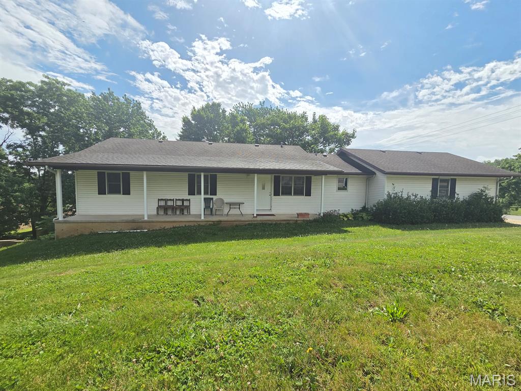 Easy move here - this spacious 3-bed, 3-bath ranch home sits 'on the hill' in Canton, and offers a nice layout, clean interior & is completely move-in-ready.  You'll appreciate the open floor plan, sunny kitchen (with plenty of cabinets & counter space, and all appliances convey!) that leads right to the dining room and opens to the big living room.  The main level includes a master suite with an oversized walk-in-closet and full bath, two additional full bedrooms and another full bath.  Downstairs you'll find plenty of storage, utility area and a full bathroom.  The basement is an open slate that could easily be finished out for more living/sleeping space, and it walks out to the private backyard.  There is plenty of outdoor space to enjoy here - the private side porch faces west and overlooks the wooded backyard, and a nice front porch is shaded and offers plenty of seating space.

You'll love this location - walk to the swimming pool and ballfield, and this is a quick 20-minute drive to Quincy, Il or Keokuk, IA.  Utility providers here include Liberty Gas, Ameren Electric, City of Canton water/sewer/trash and both Rise & Brightspeed Fiber are available.

New in 2000, this home has been well-maintained and might not last long.