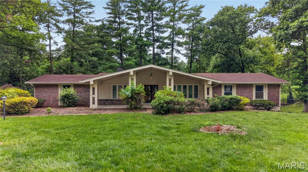 This sprawling ranch home sits on a large lot on a quiet no through street.  You'll appreciate the side entry attached garage and long driveway. The covered front porch opens to a large entry and formal living room and dining room. The great room features unique peg and plank wood flooring, lots of character with the hidden bar area, vaulted wood beams, natural light, and a brick fireplace.  Walk out to the deck overlooking the backyard and enjoy your morning coffee. The large kitchen features plenty of cabinetry, center island, and breakfast room. Convenient main floor laundry. Gorgeous hardwood flooring throughout the hallway and all 4 bedrooms. The primary suite features a full bathroom and large walk in closet. The other 3 bedrooms are very generous in size as well. The massive lower level is partially finished with a large recreation room and a ton of possibilities for future uses. Excellent location close to hospitals, schools, shopping, restaurants, highways and more. Property is being sold in "as is" condition. Buyer will be responsible for obtaining the occupancy permit.