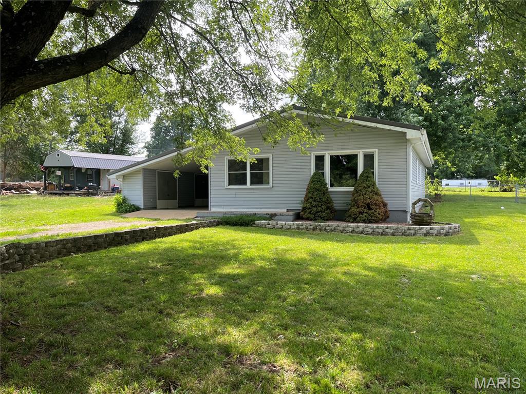NICE!  3 bedroom, one bath home just north of Pilot Knob, Mo.  This 1162 sq ft home has been well maintained and is move in ready!   Nice fenced yard and large carport with storage. Would make great starter home or would work well for retirees.  Good well and new engineered septic system, new metal roof, large utility room and more.. a great place to call home...