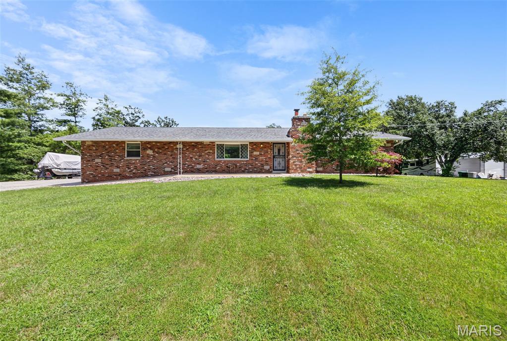 Welcome home to this move-in-ready brick-front ranch offering the perfect blend of space, comfort, and privacy! Situated on 1.8+ mostly level acres backing to mature woods, this property provides plenty of room to add a detached garage, pool, or outdoor entertaining space.

Featuring 5 bedrooms, 3 full baths, a supersized 2-car garage, and approximately 2,700 square feet of finished living space, this home has been thoughtfully updated with fresh neutral paint, newer main-floor vinyl planking, new architectural roofing, and new siding, enhancing both curb appeal and peace of mind.

The spacious eat-in kitchen includes all appliances and flows into a large separate dining room with sliding glass doors leading to the deck and backyard. The primary suite offers a generous 14x15 bedroom with a private bath, while two additional main-level bedrooms are impressively sized at 11x13 and 11x12. All blinds and window treatments are included.

The finished walkout lower level features an expansive 37x16 family room with a beautiful brick fireplace, a large fifth bedroom with an oversized 4x12 closet, and a convenient combination bath/laundry room. Recent improvements include drain tile, a sump system for a dry basement, and an updated electrical panel.

With its desirable updates, flexible floor plan, and serene setting, this is a home you won't want to miss!
